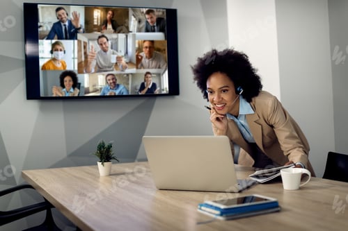 Preview: Happy African American Entrepreneur Using Computer During Business Video Conference In The Office.