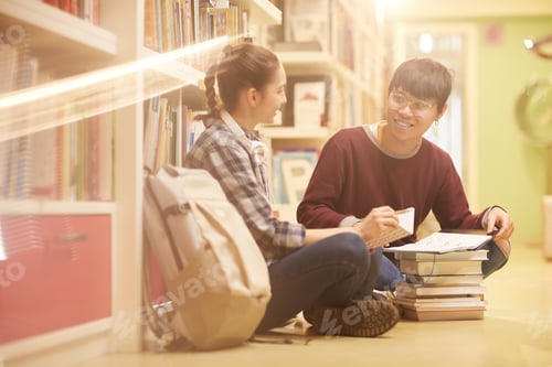 Preview: Students doing homework in the library