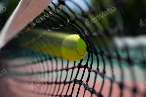 Preview: Tennis ball hits in the net during game.