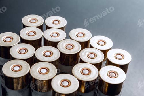 Preview: Rifle bullets or cartridges on black shiny background