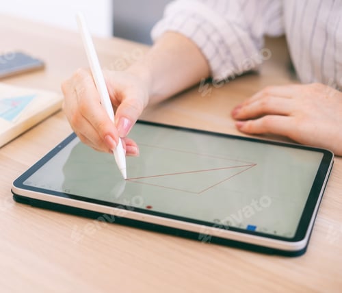 Preview: Woman Using a Stylus on a Tablet Device