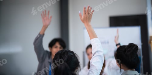 Preview: Businesspeople giving a high five to male colleague in meeting teamwork. business professionals