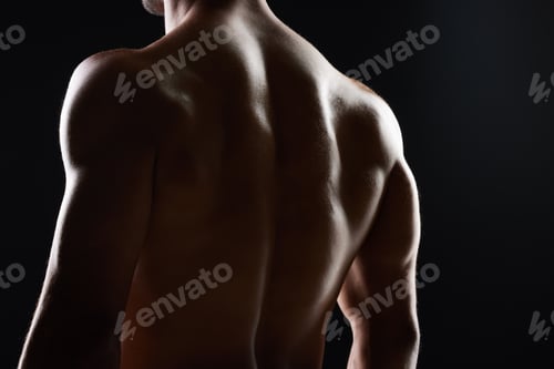 Preview: Man, back and muscle with silhouette, studio and shadow for wellness, health and strong by black ba