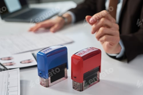 Preview: Woman Processing Visa Applications at Visa Center Desk