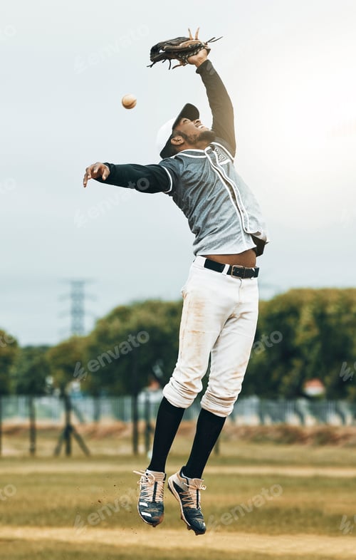 Preview: Baseball, sport and person fielder jump on an outdoor sports field during sport game or match. Fitn