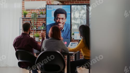 Preview: Business people using online conference to discuss strategy
