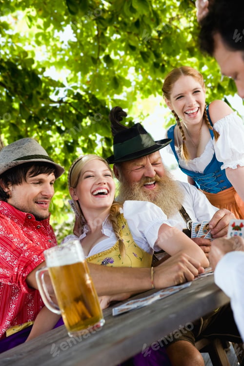 Preview: Germany, Bavaria, Upper Bavaria, People playing cards in beer garden