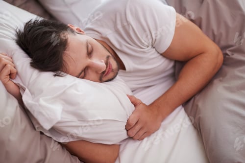 Preview: Tired man resting in the bed