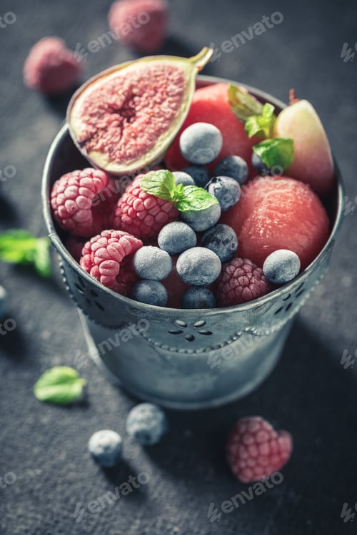 Preview: Top view of ice cream sorbet with berries and watermelon
