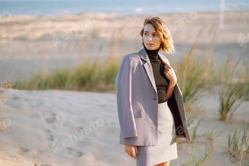 Preview: Fashion Model posing near the sea. Young woman resting in nature. People, lifestyle, relaxation.