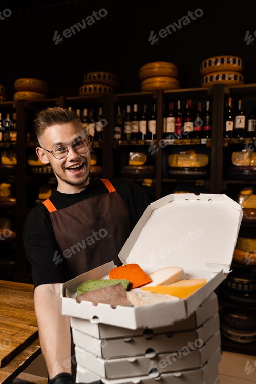 Preview: Excited cheese sommelier showcasing assorted artisan cheeses