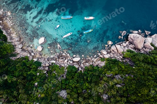 Preview: Bay and boats form above in island