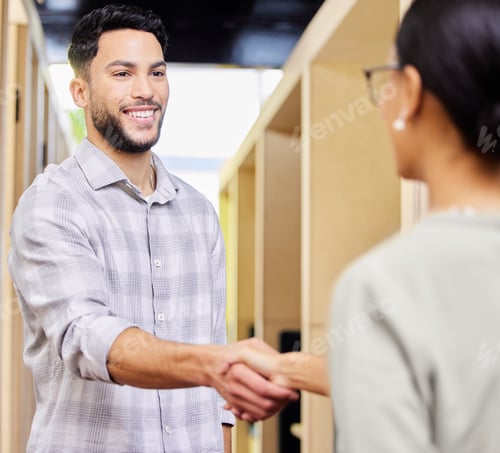 Preview: Cropped shot of a handsome young businessman shaking hands with a female colleague in the office