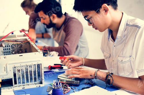 Preview: Group of people working at eletronic repair shop