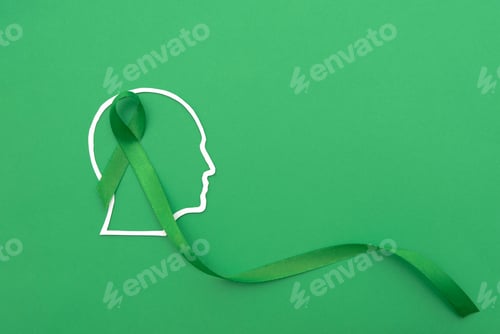 Preview: Profile outline of human head with a Green Ribbon on a Green Background