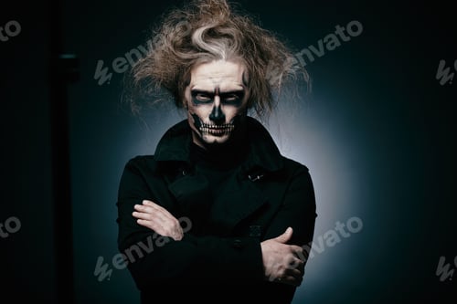 Preview: Skull makeup portrait of young man. Halloween face art.