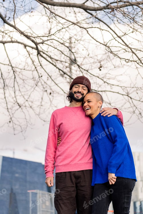 Preview: young couple laughing happy during a romantic walk