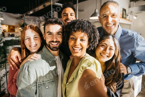 Preview: Group of diverse business people taking selfie in office