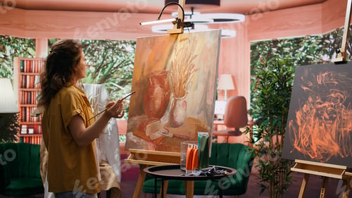 Preview: Skilled painter recording a video of his finished creation for self promotion