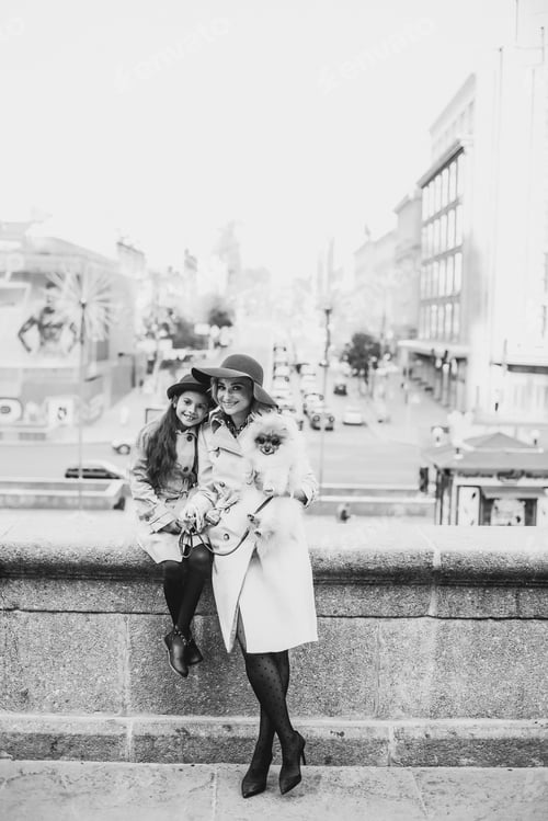 Preview: Mom and daughter on a walk with their pet dog. Family and friendship concept.