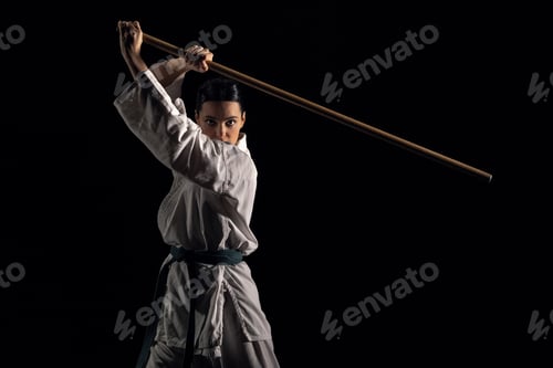 Preview: Woman in kimono practicing with jodo