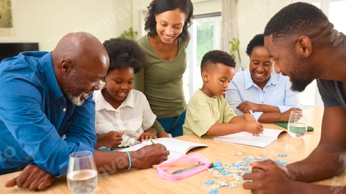 Preview: Multi-Generation Family Helping Children With Homework Sitting At Table