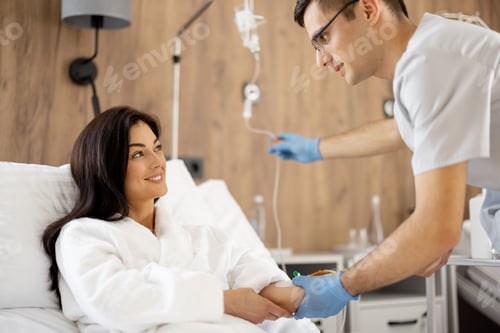 Preview: Nurse prepares dropper for a young female patient