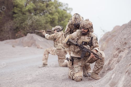 Preview: Soldiers in camouflage military uniforms carrying weapons Reconnaissance missions in rugged mountain