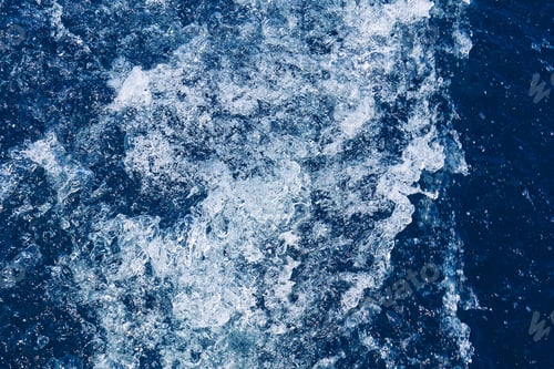 Preview: Abstract blue sea water with white waves. Blue sea texture with waves and foam. Mediterranean sea