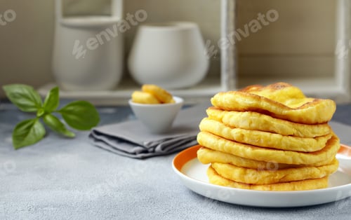 Preview: fried thin flatbreads with sauce on the table