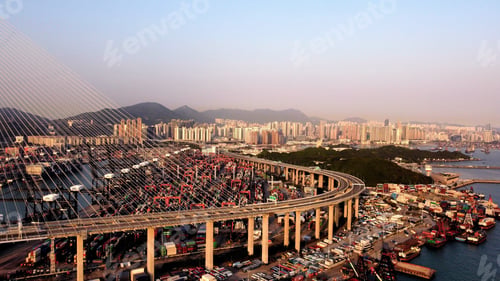 Preview: Bird's eye view of the Stonecutter Bridge against the cityscape of Hong Kong at sunset