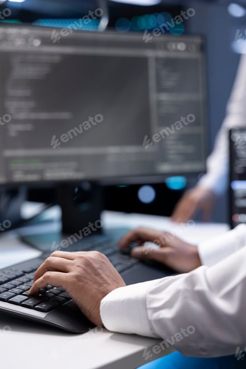 Preview: Close up shot of IT employee doing maintenance on storage arrays in servers room