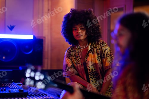 Preview: Portrait of diverse producer at music studio listening guitarist playing