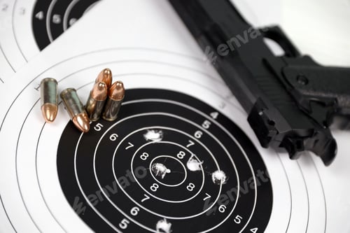 Preview: Gun and many bullets shooting targets on white table in shooting range polygon