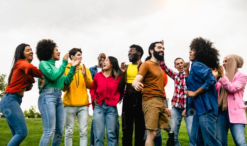 Preview: Young multiracial friends having fun dancing together in park - Friendship and diversity concept