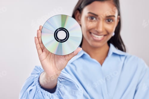 Preview: Woman, compact disk and smile in studio portrait for programming, software and information technolo