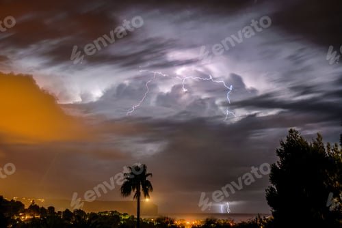 Preview: Extreme weather. Thunderstorm with high wind, storm clouds and lightning over sea.