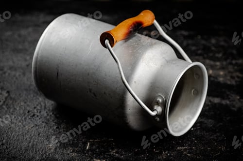 Preview: An empty milk can on the table.