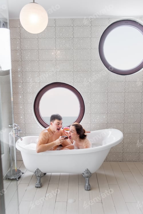 Preview: Couple in love takes a white foam bath together, eat bright, sweet donuts, have fun, fool around.