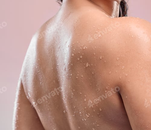 Preview: Moisturised skin is beautiful skin. Shot of a womans back against a studio background.