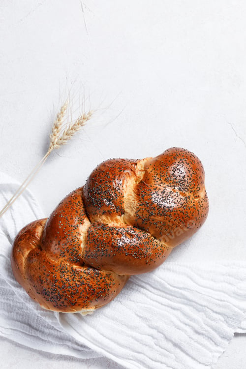 Preview: Homemade crusty loave of wheat candy bun with poppy seed