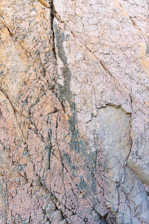 Preview: Rocky background with textured wall in bright light