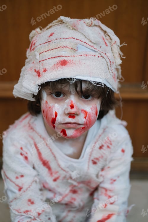 Preview: Little boy dressed in mummy in the street