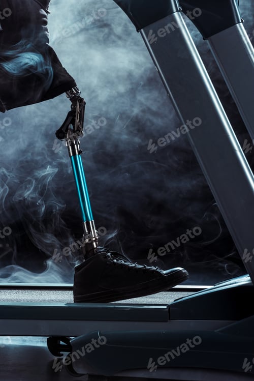 Preview: selective focus of paralympic sportsman with leg prosthesis training on treadmill