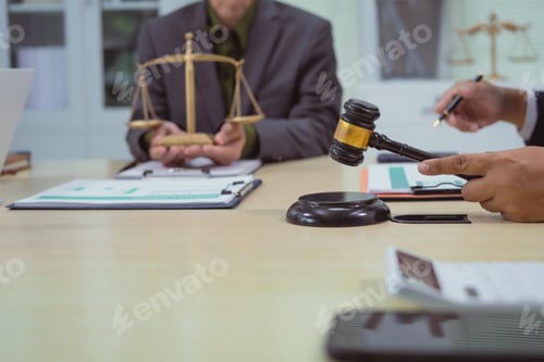 Preview: Three lawyers in a meeting at the table in an office, discussing business,civil and commercial law
