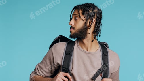 Preview: Happy delivery part time employee using thermal backpack to bring food order