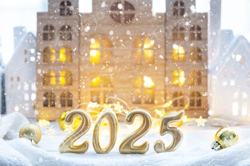 Preview: Golden figures number 2025 against the background of cozy windows of a house with warm light with fe