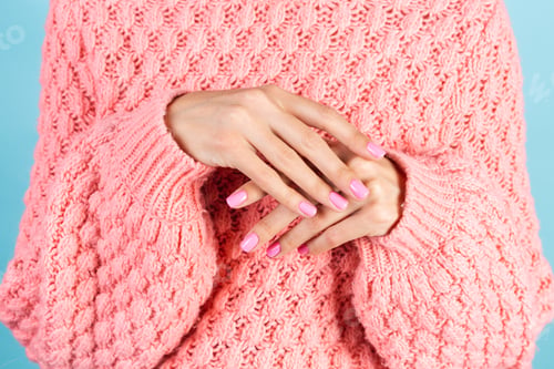 Preview: womans hands with bright pink nail color