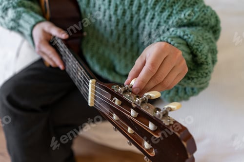 Preview: A woman playing a guitar