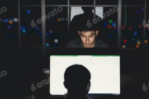 Preview: Asian businessman working hard late with her technology laptop in office, customer service